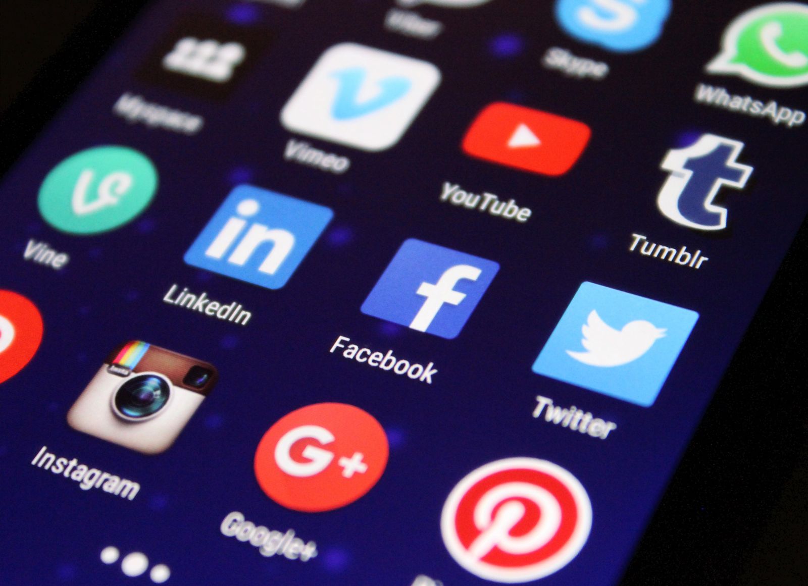Smartphone screen showing social media app icons used for social media strategy and channel planning.